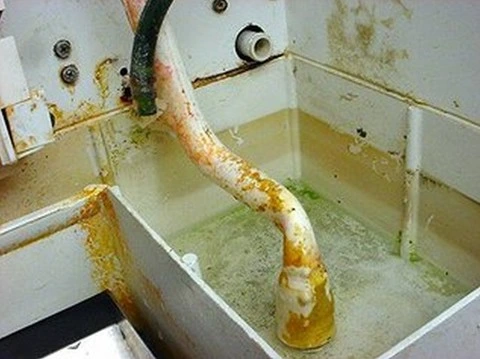 Ice machine pipework with mold, slime, and scale buildup